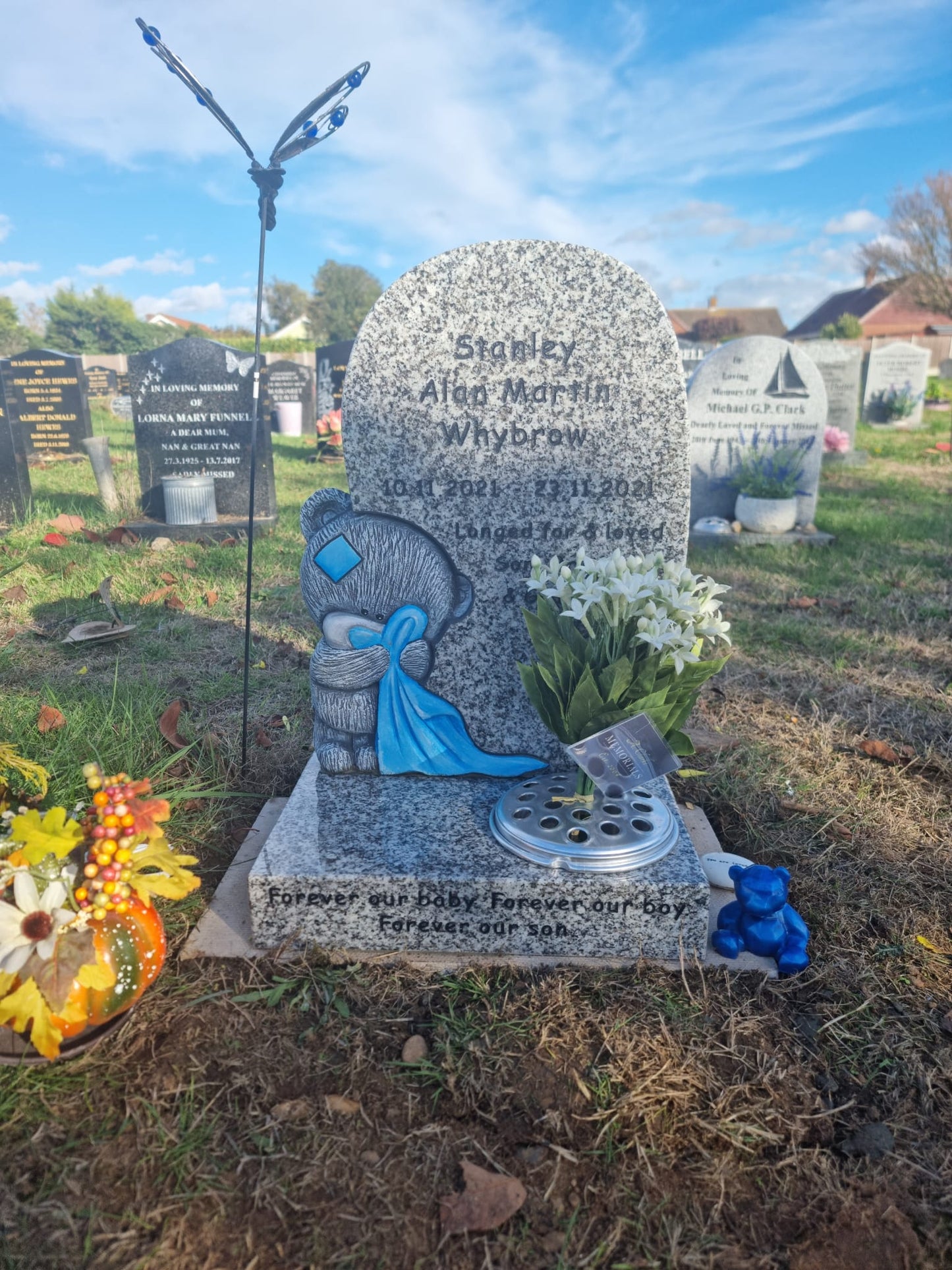 Double arch memorial with kerbs to match