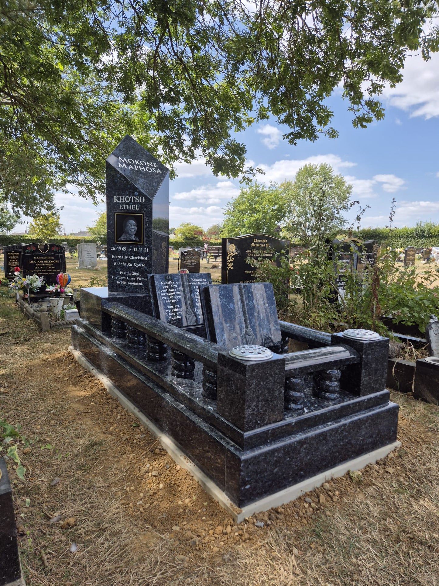 Classic square memorial with side columns & layered base