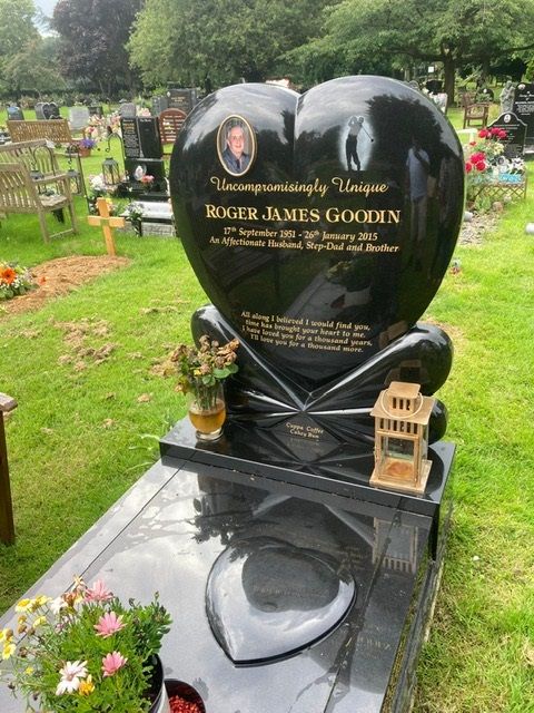 Heart shaped memorial with ogee front base and carved wild roses