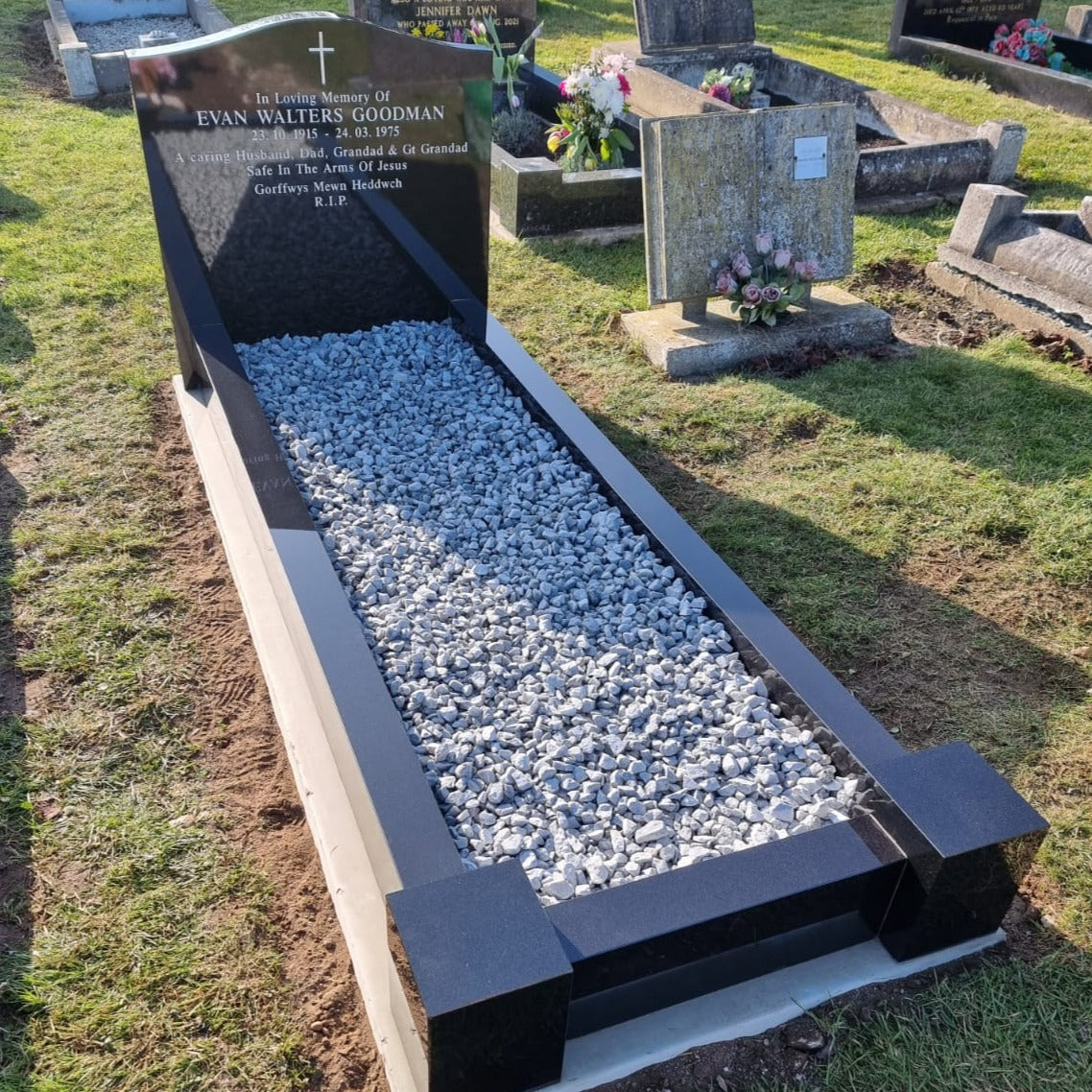 Ogee headstone with kerbs and corner posts