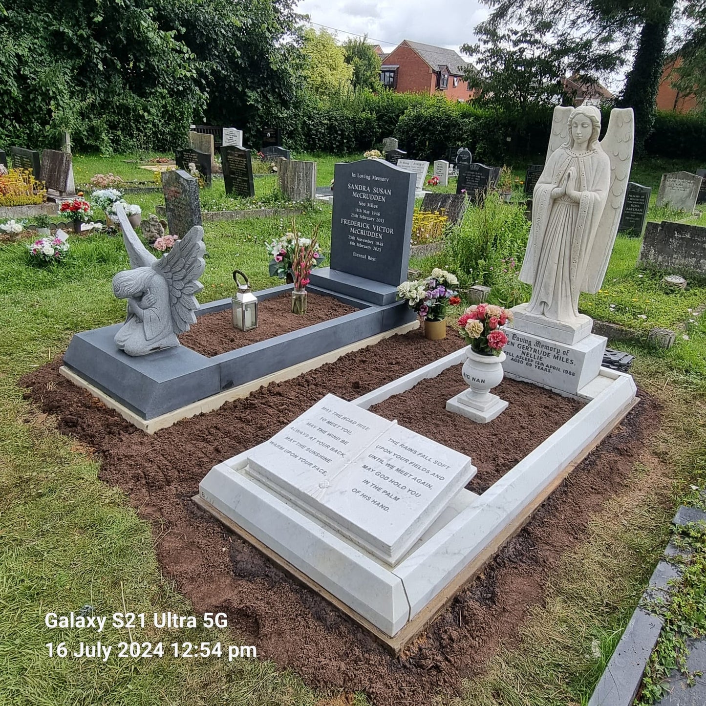 Carved Angel Leaning Over Heart Shaped Memorial