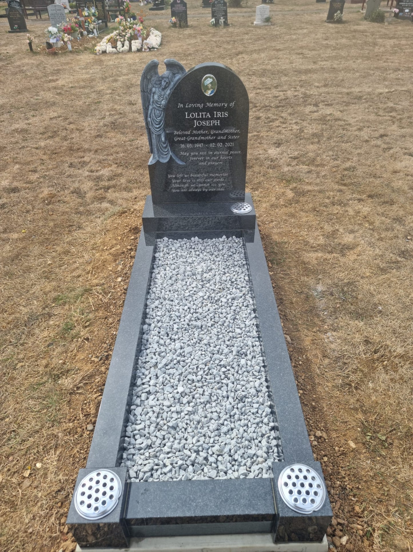 Rounded Headstone With Mourning Angel