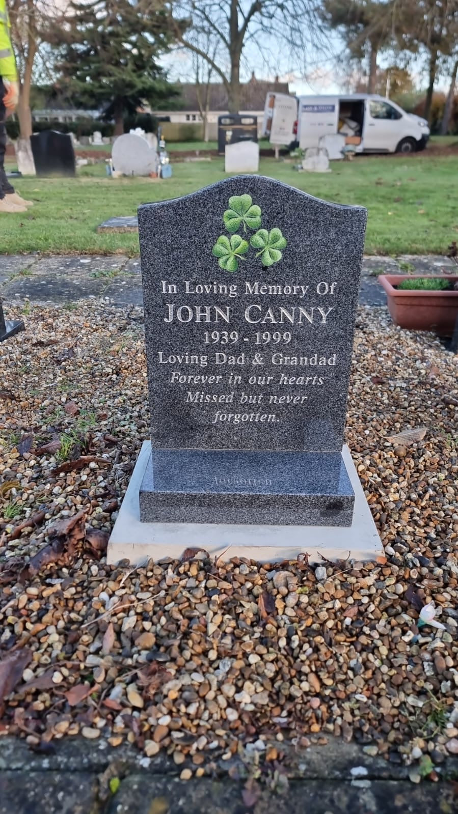Shamrock memorial with square base.