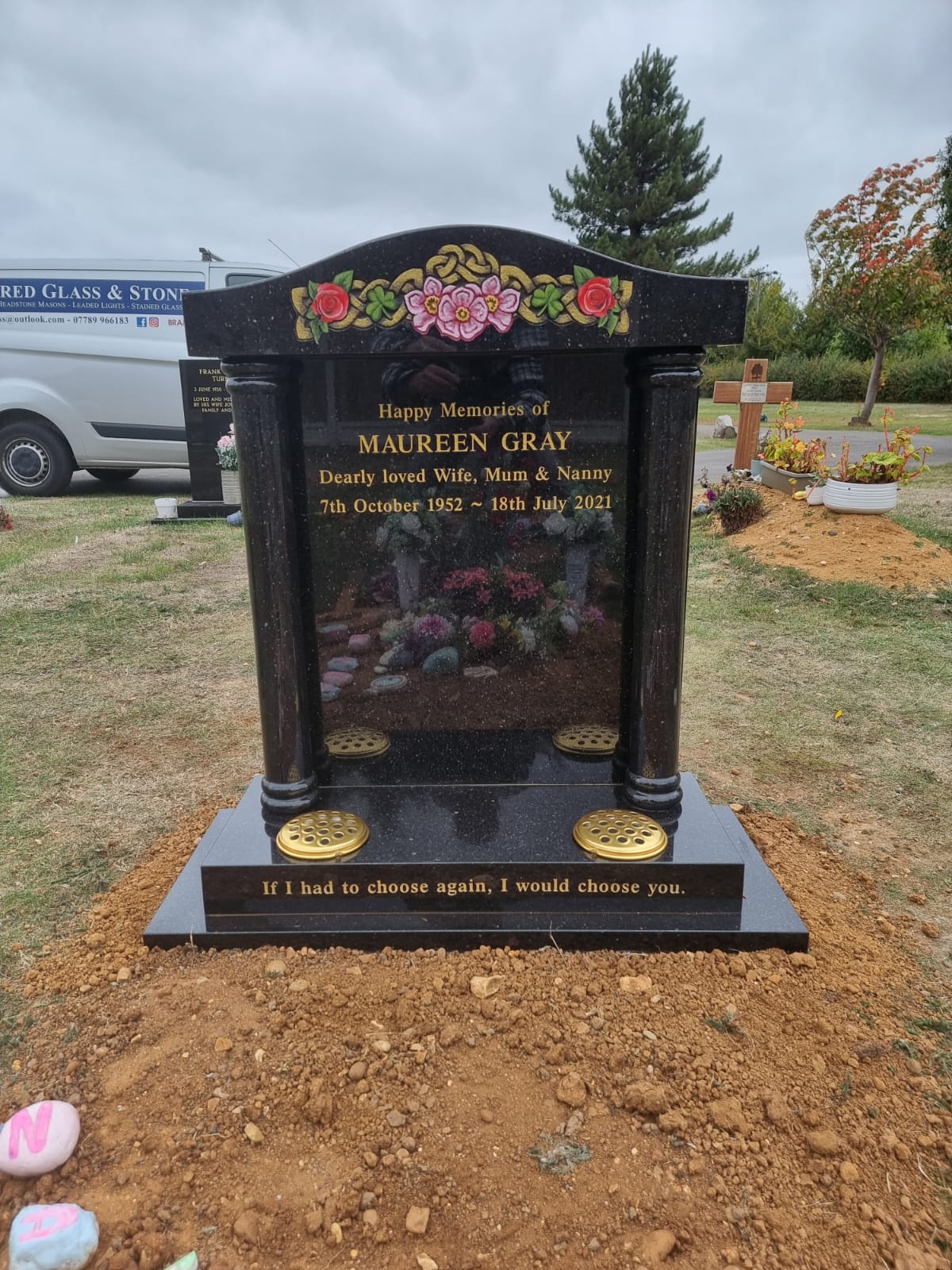 Temple style memorial with ogee top and square base.