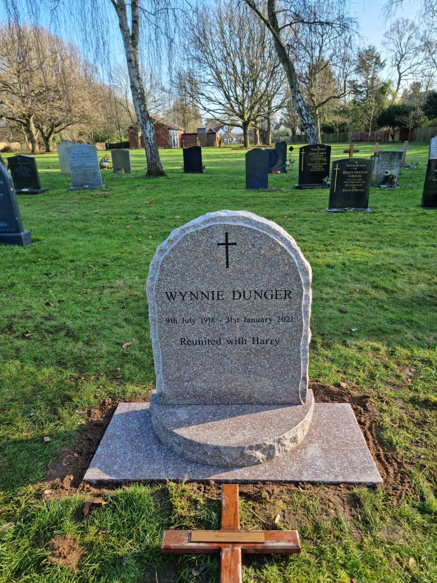 Rustic edge, pitched margin, round top memorial