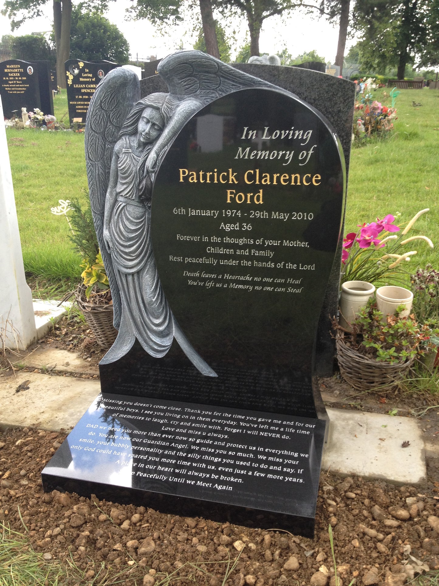 Rounded Headstone With Mourning Angel