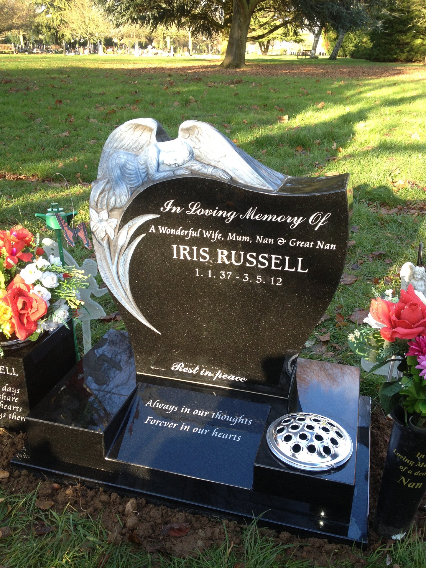 Carved Angel Leaning Over Heart Shaped Memorial