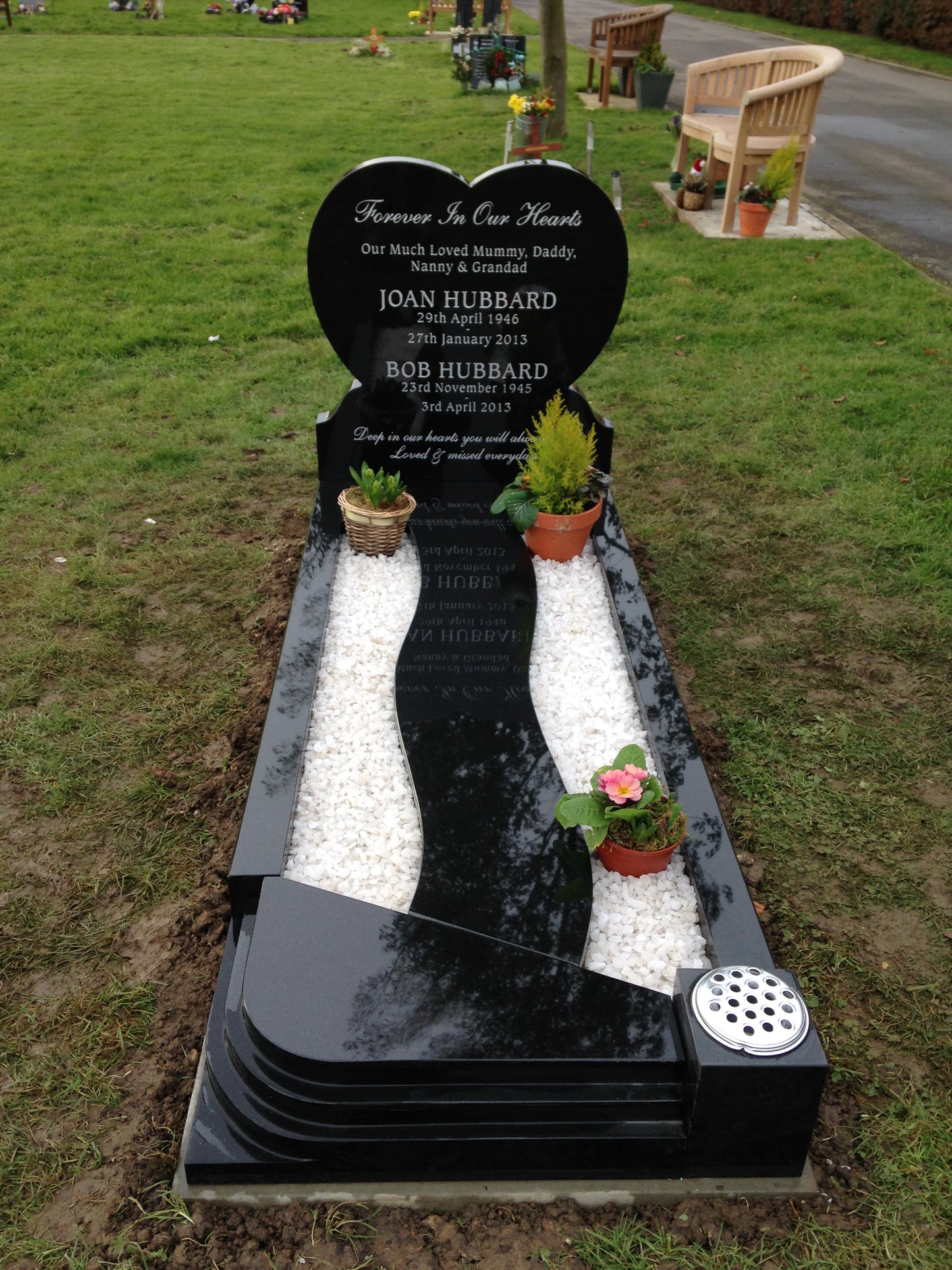 Heart memorial with carved roses to to both sides