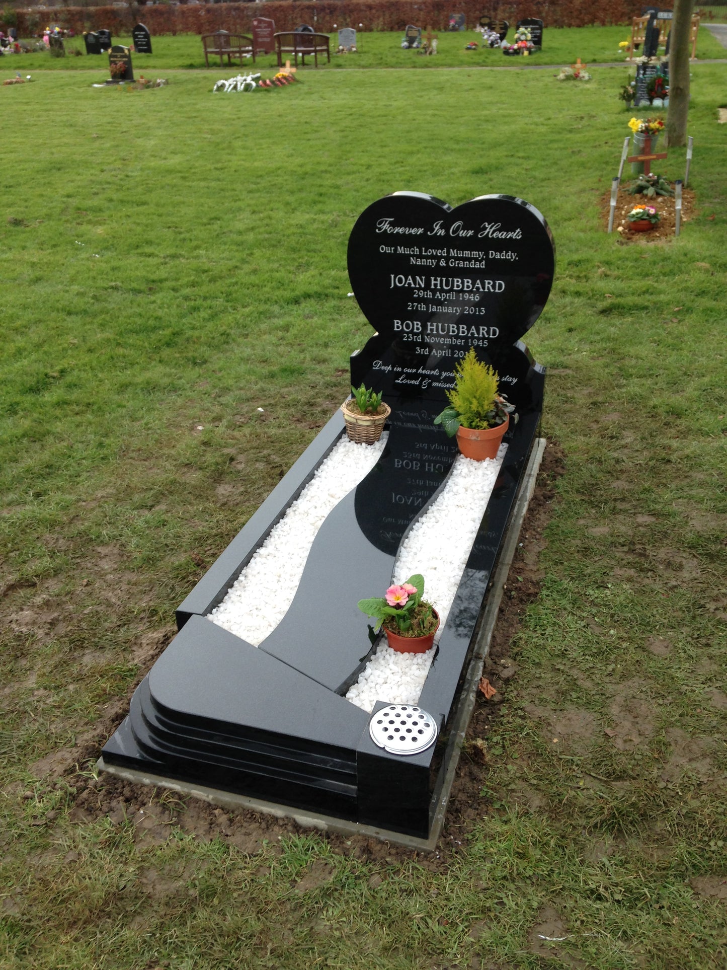 Heart shaped memorial with ogee front base and carved wild roses