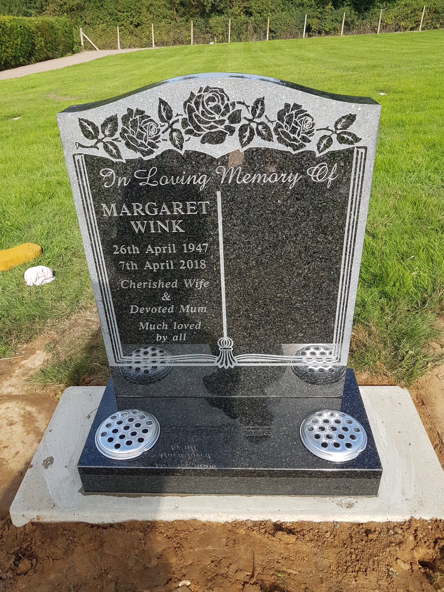 Ogee shaped memorial with sandblasted book and rose design