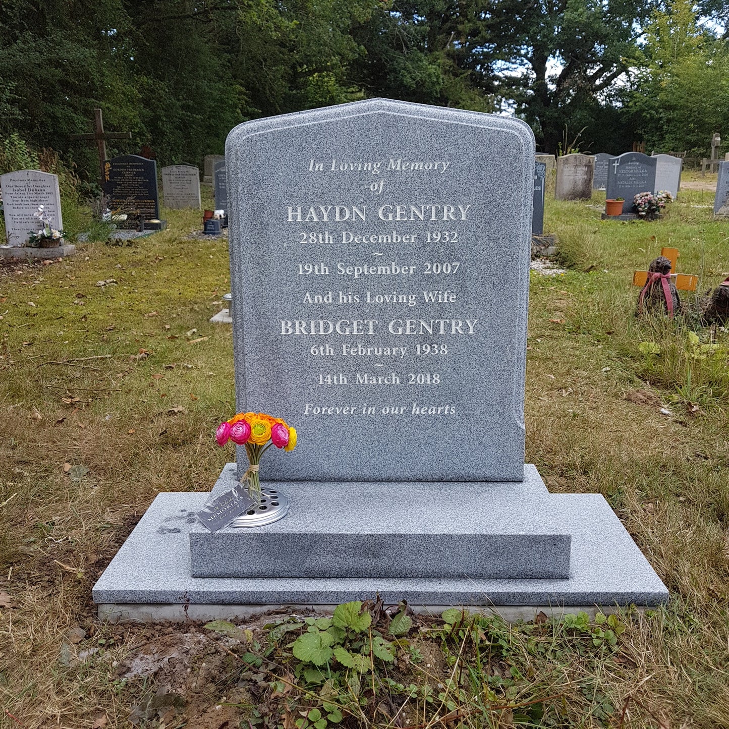 Peon top memorial with sandblasted rose and cross panel