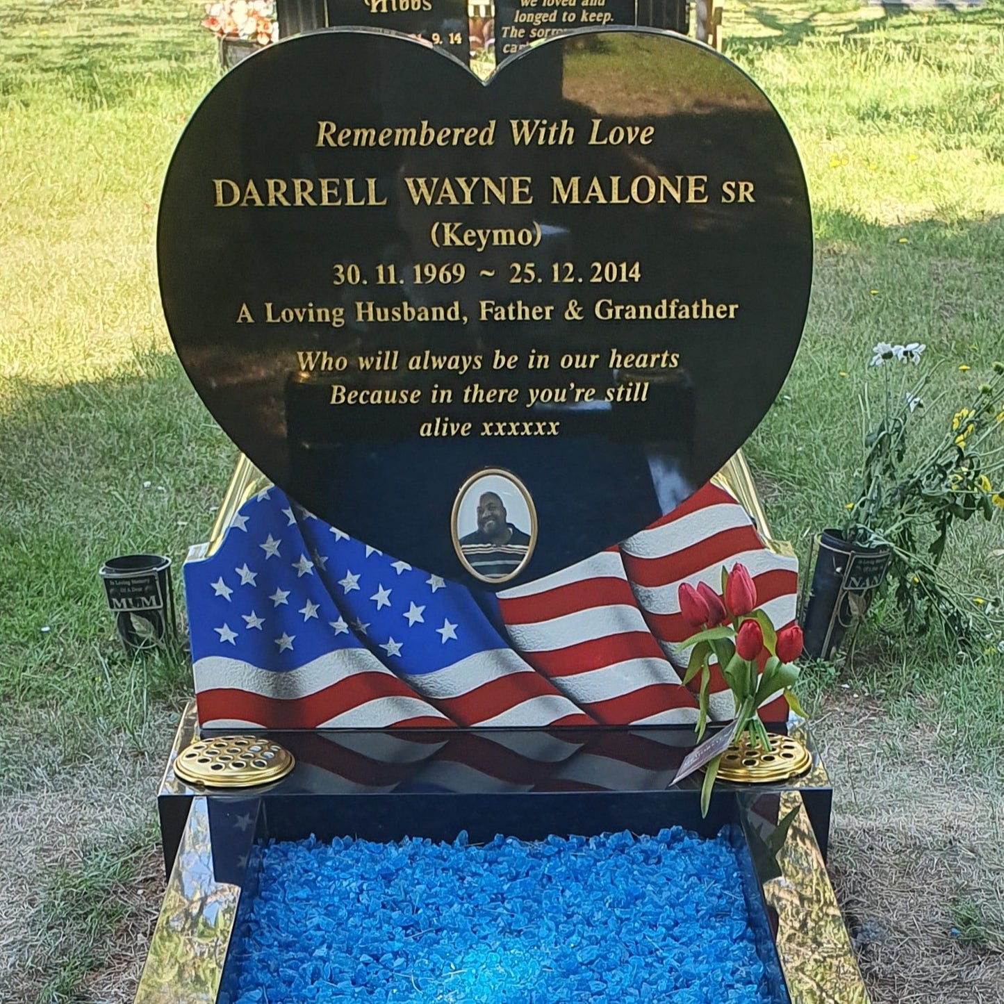 Heart shaped headstone with cover slab to kerbs