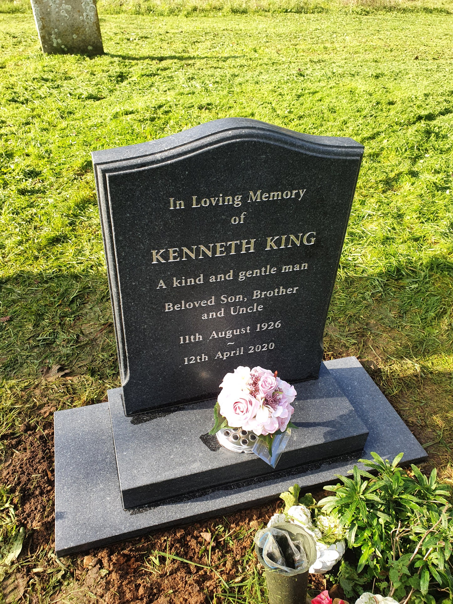 Peon top memorial with sandblasted rose and cross panel