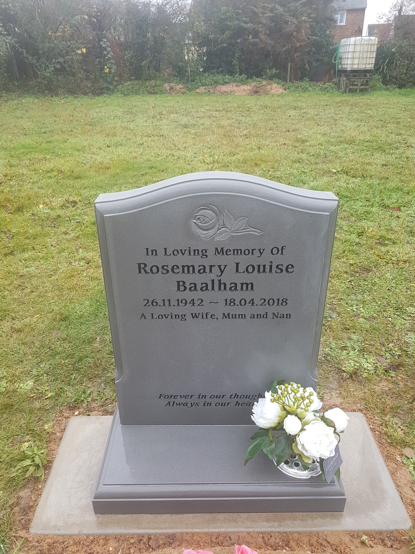 Ogee memorial with central carved roses