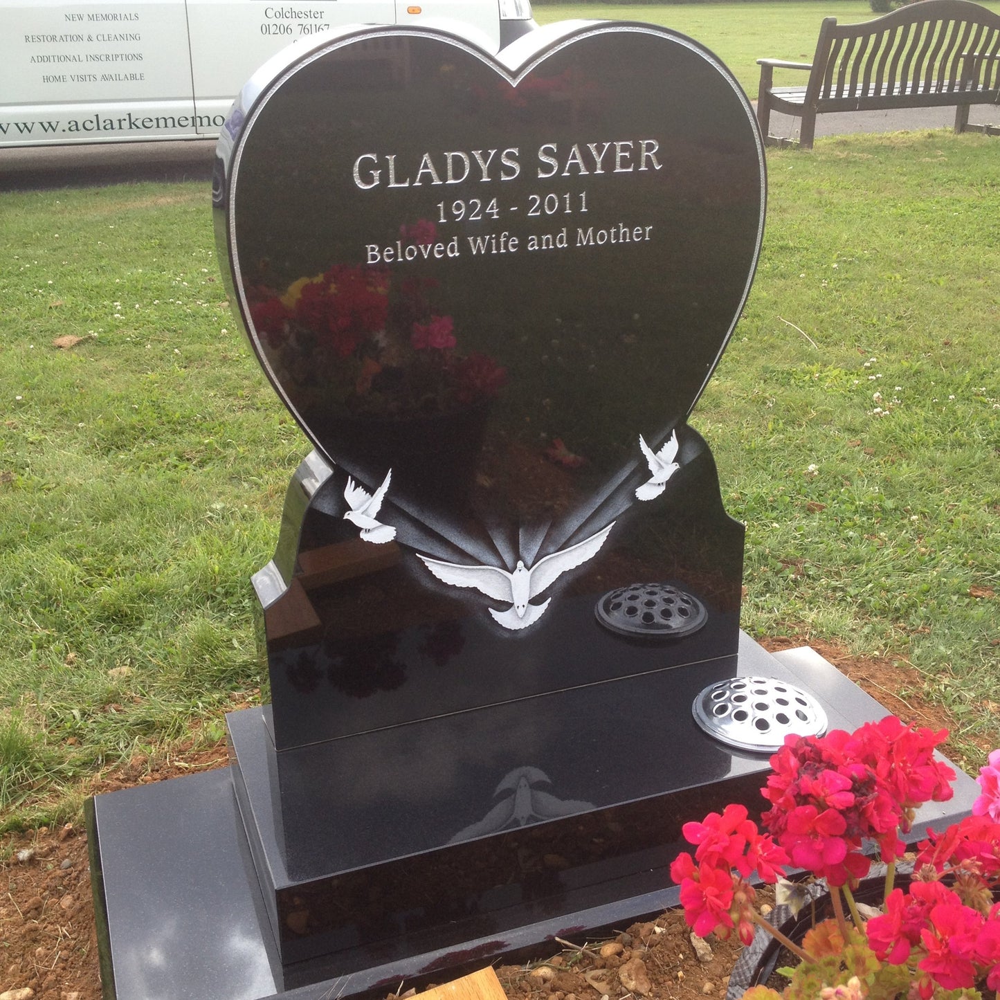 Heart memorial with carved roses to to both sides