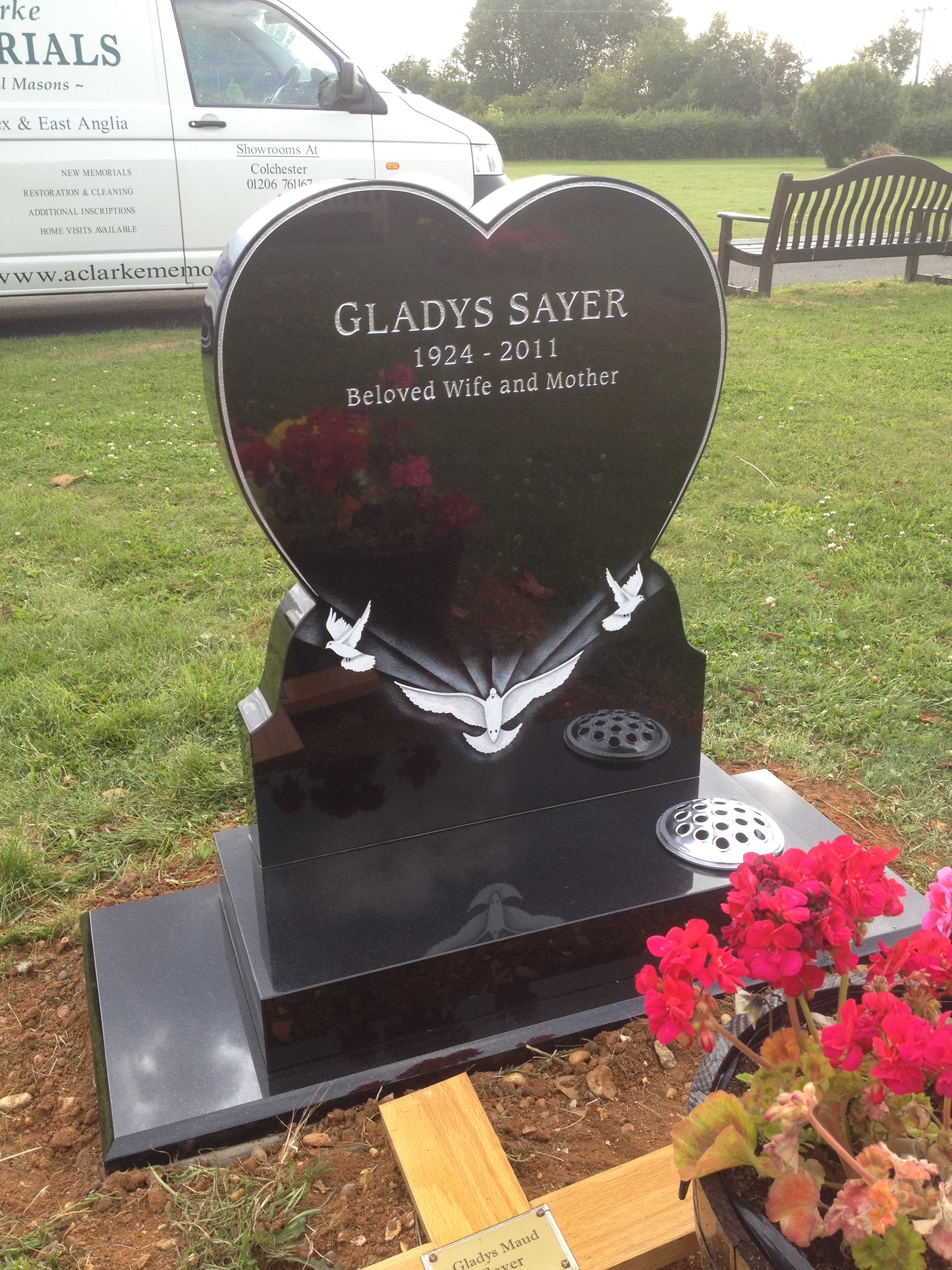 Heart shaped memorial with ogee front base and carved wild roses