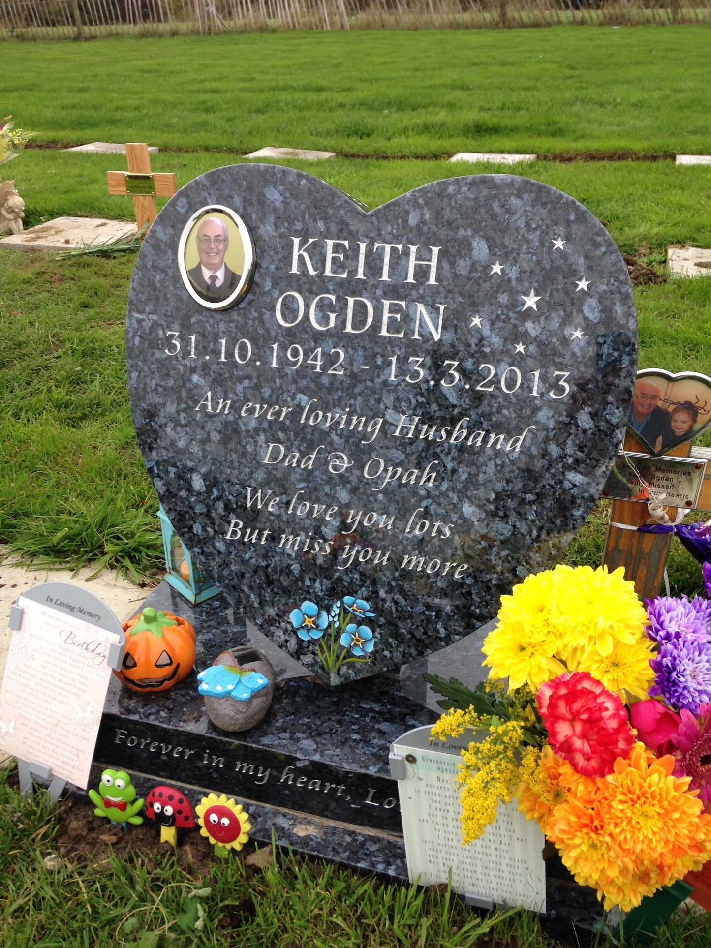 Heart shaped memorial with ogee front base and carved wild roses