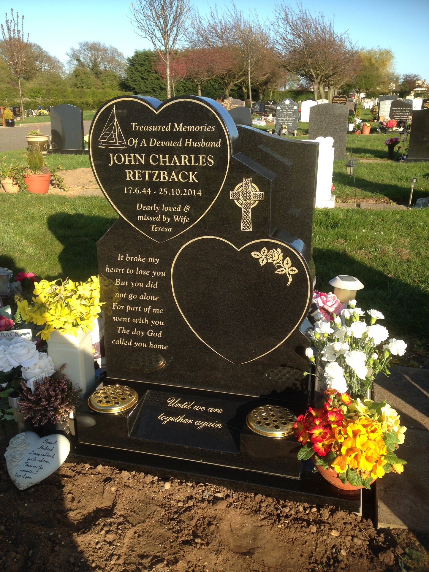 Heart shaped memorial with ogee front base and carved wild roses