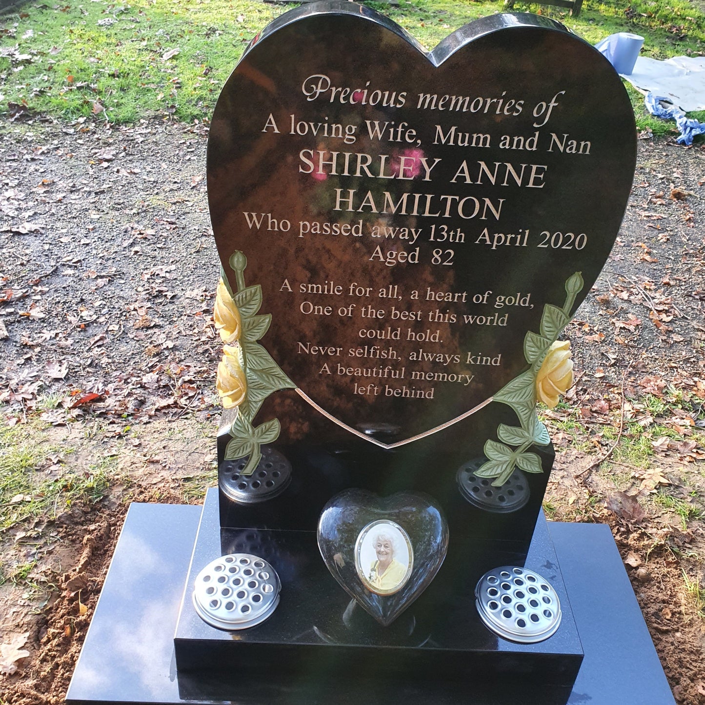 Heart memorial with carved roses to to both sides