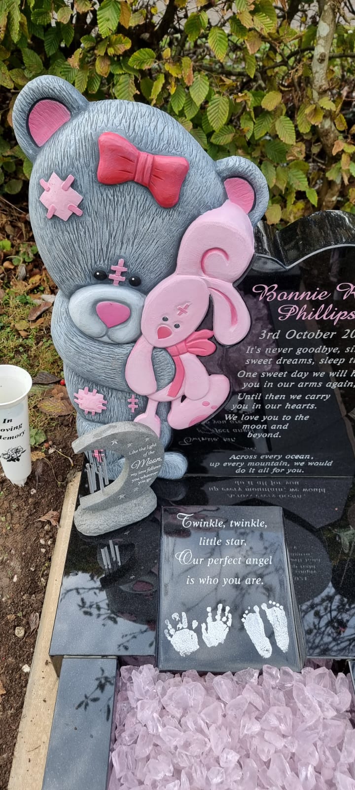 Carved standing teddy bear memorial with curved base to match