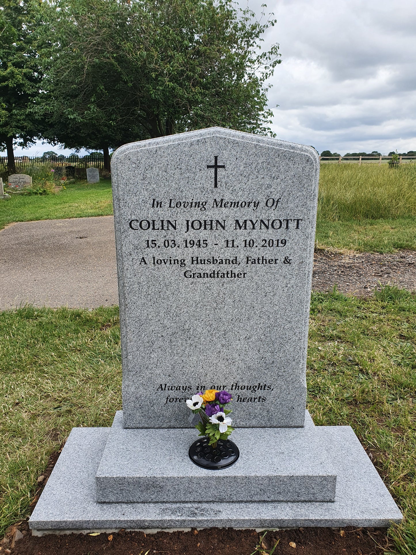 Peon top memorial with sandblasted rose and cross panel