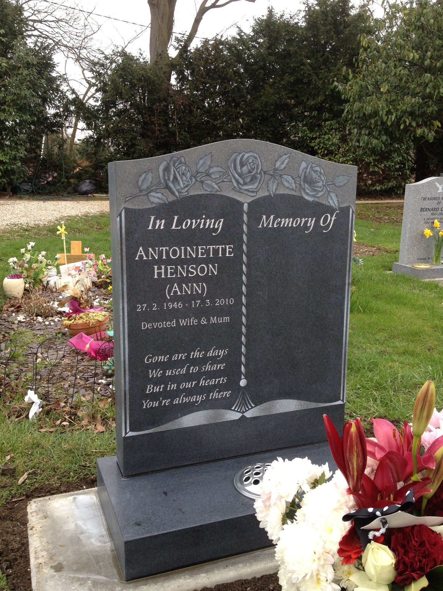 Oval Top Headstone With Scotia Shoulders And Rose Design