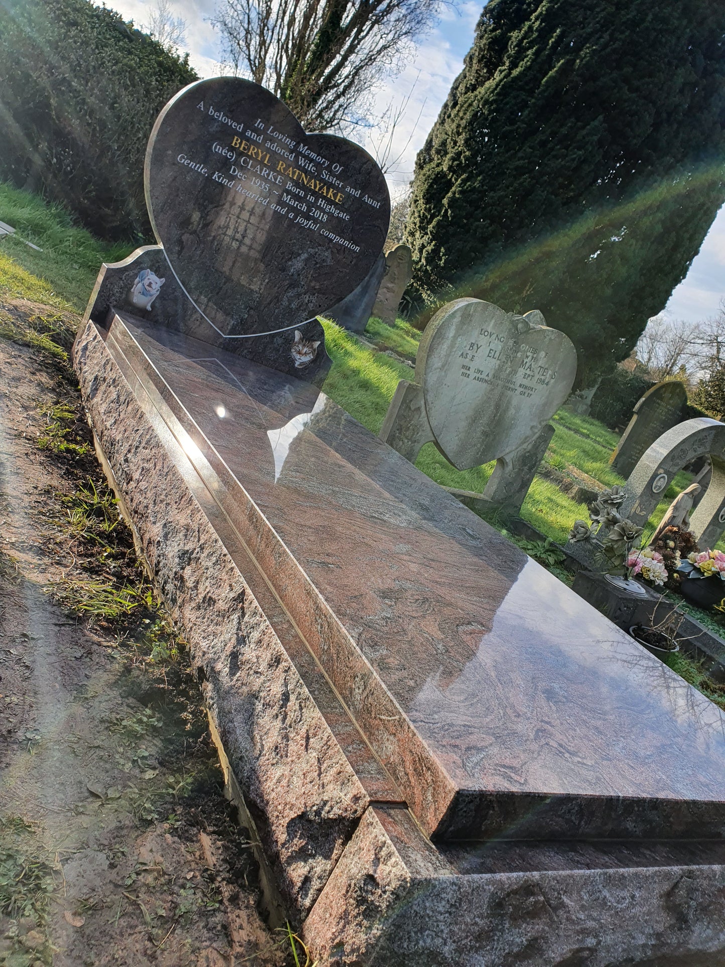 Heart memorial with carved roses to to both sides