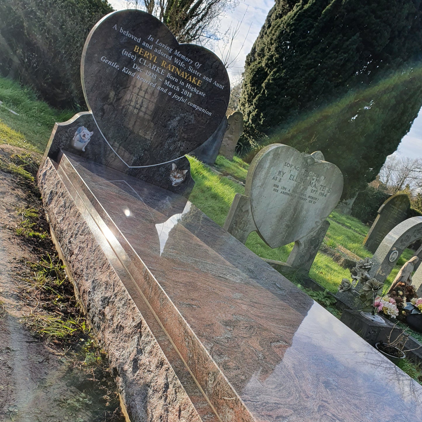 Heart shaped headstone with cover slab to kerbs