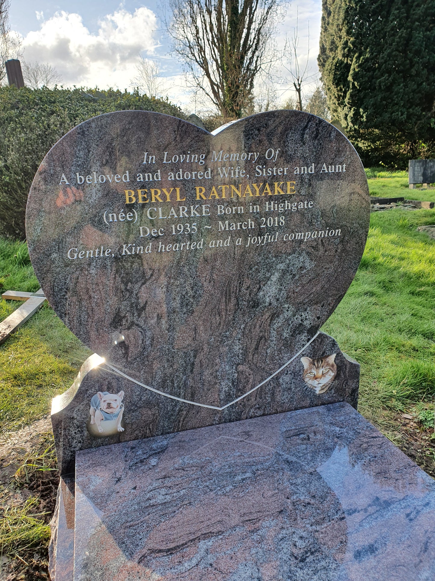 Heart shaped memorial with ogee front base and carved wild roses