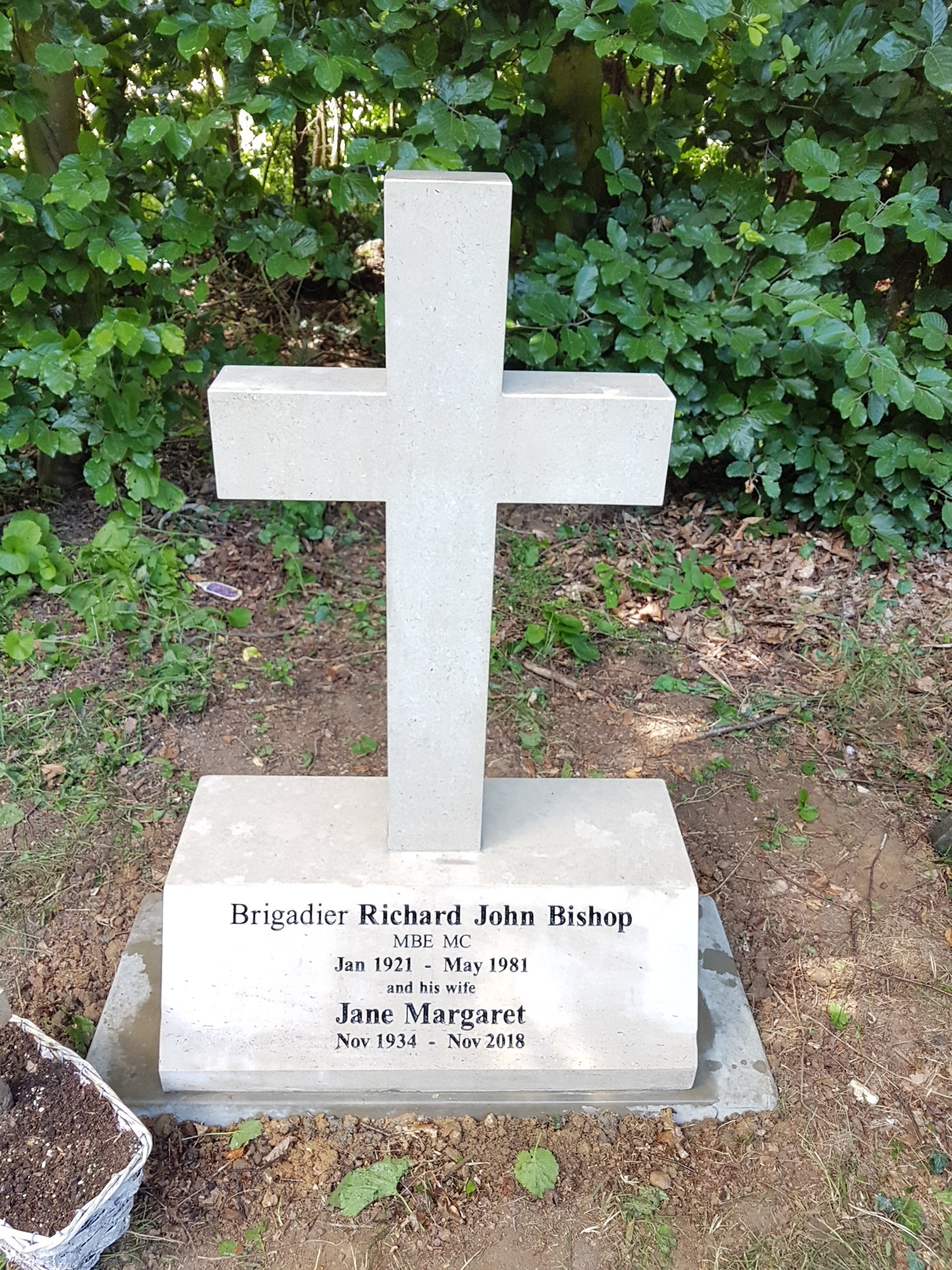 Latin cross on peon shaped memorial with square base