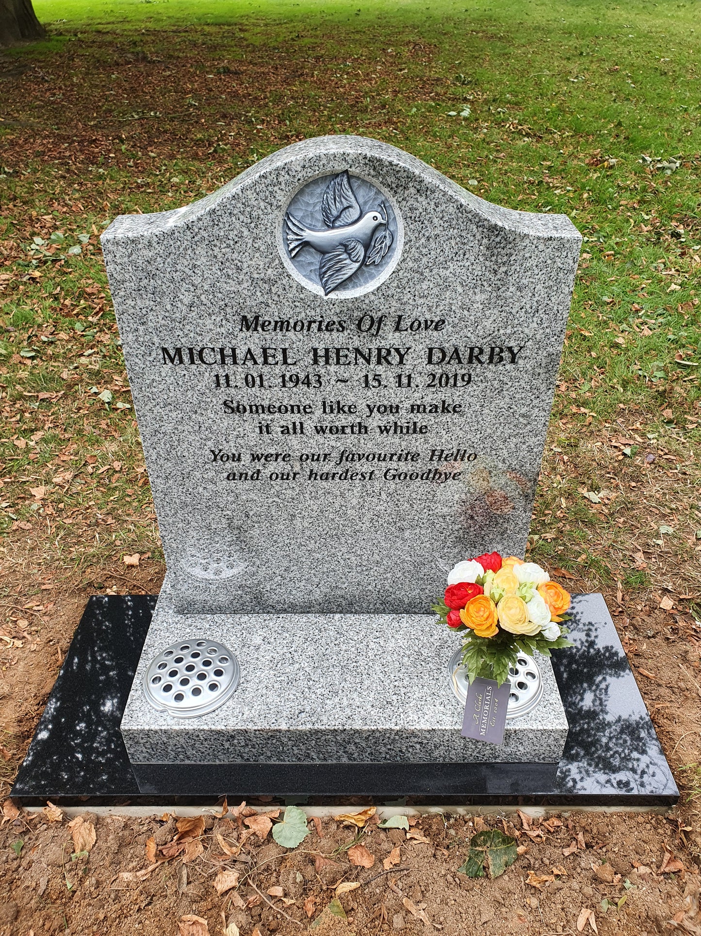 Deep ogee shaped memorial with carved dove of peace