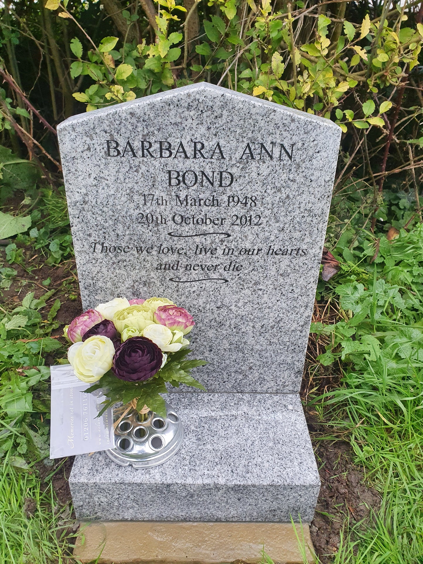 Peon top memorial with sandblasted rose and cross panel