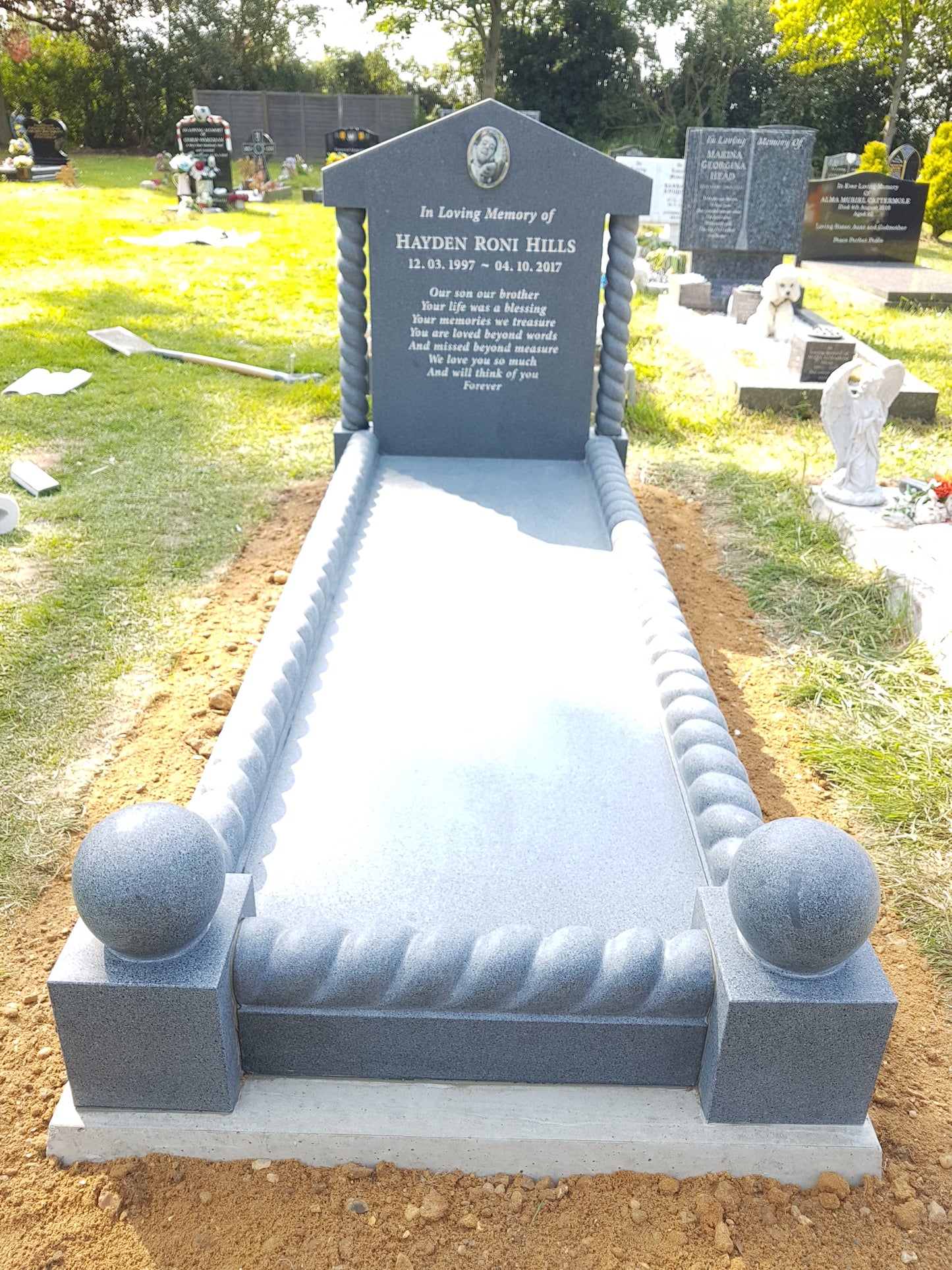 Classic square memorial with side columns & layered base