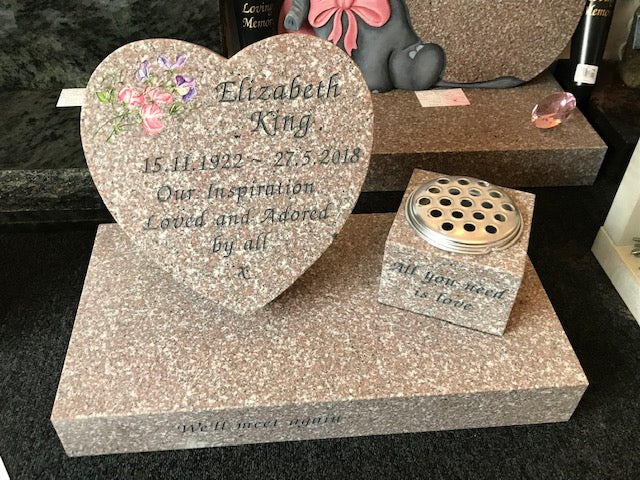 Cushioned heart memorial with carved roses to side