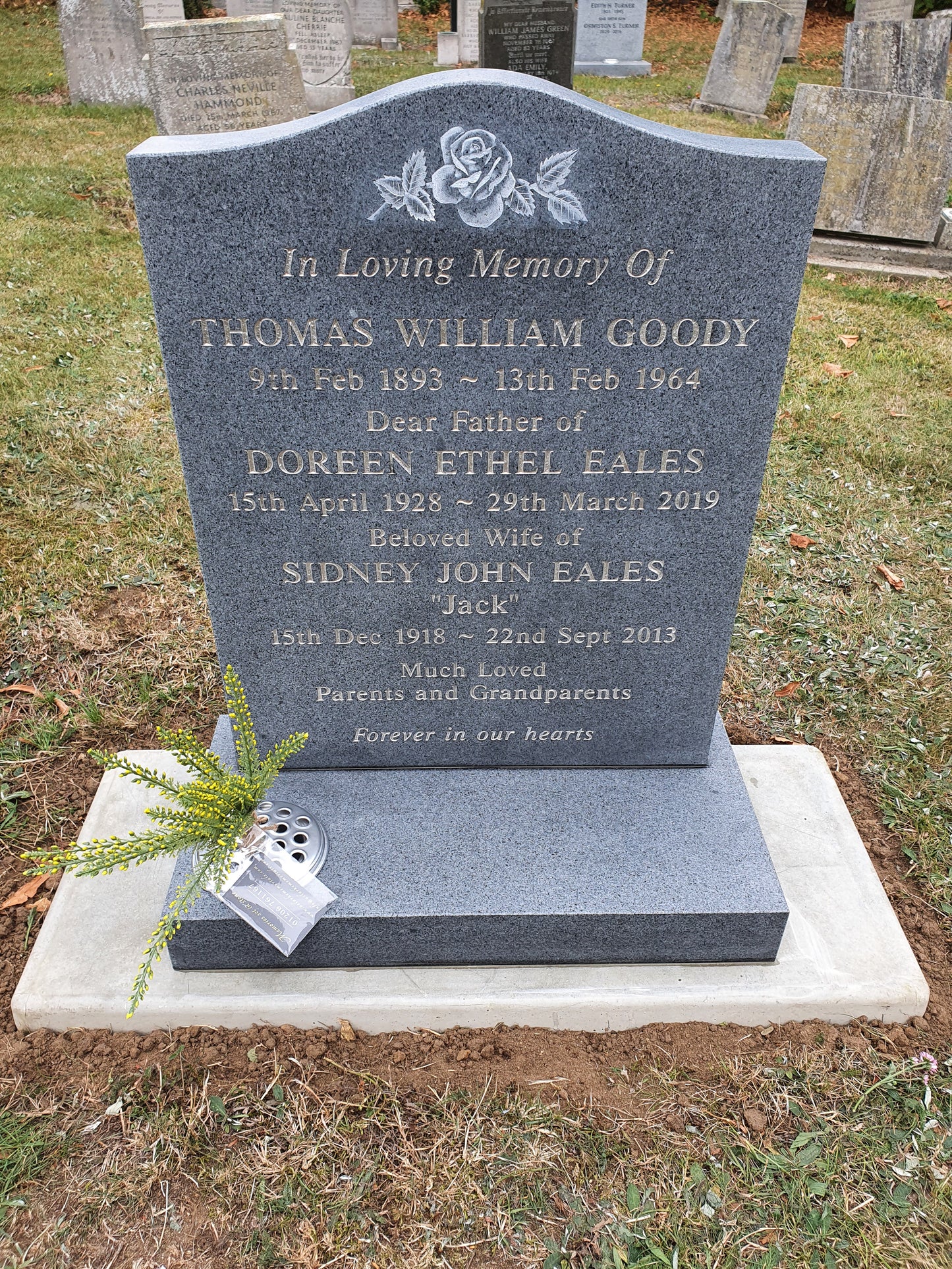 Ogee memorial with central carved roses