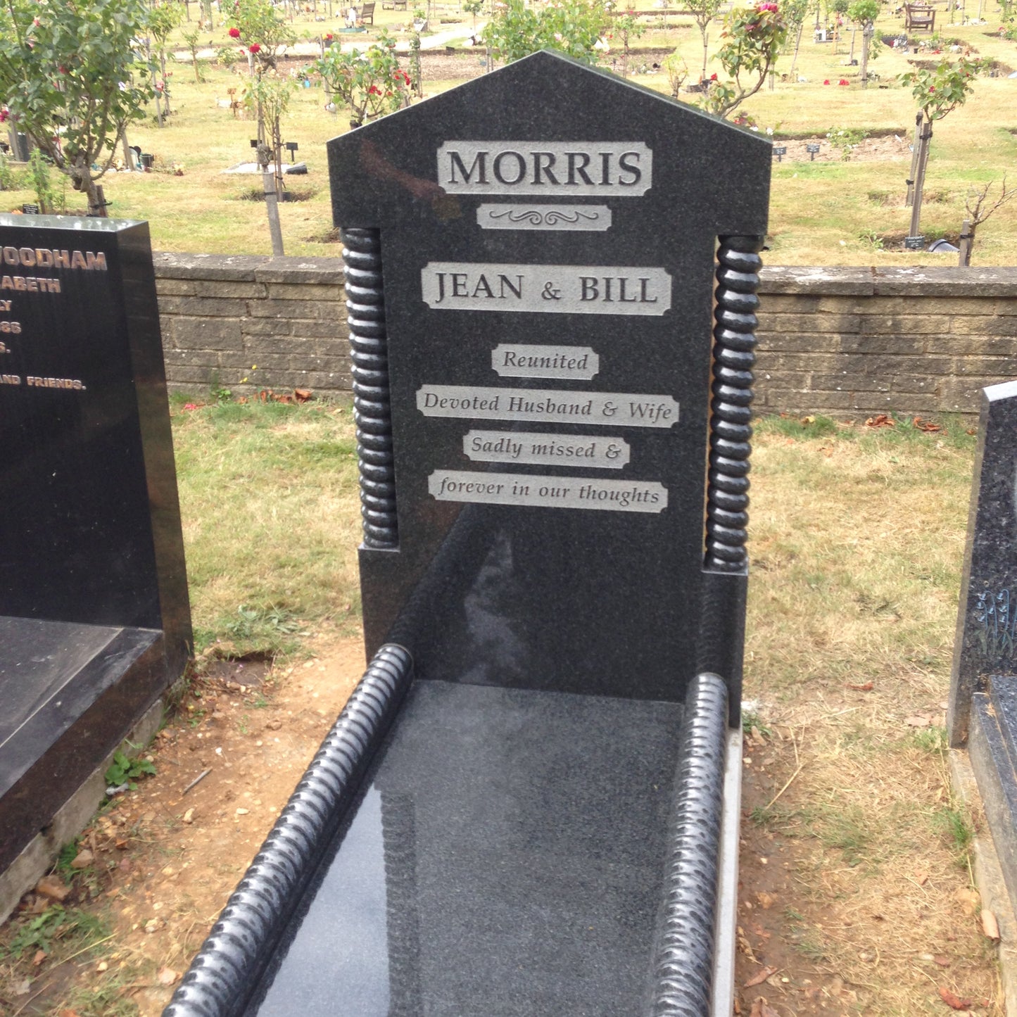Classic square memorial with side columns & layered base