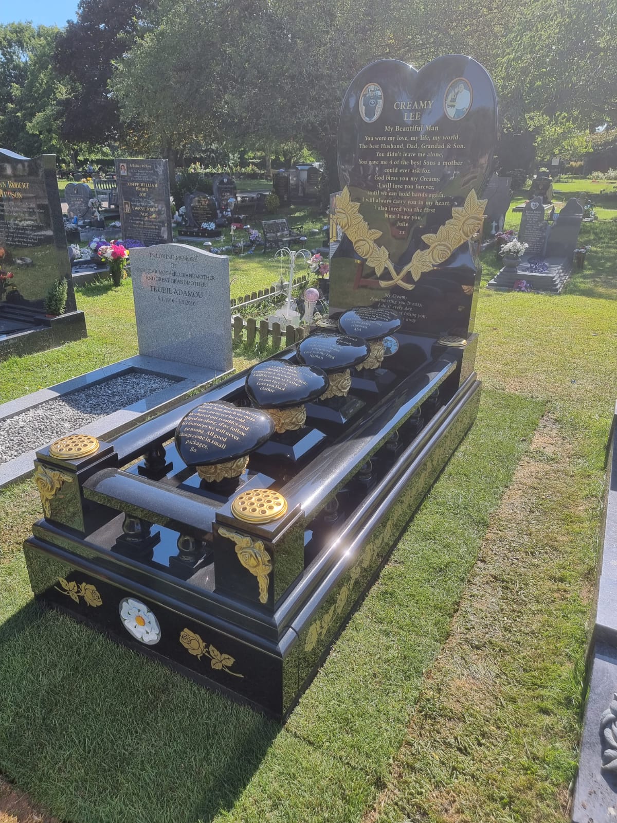 Heart memorial with carved roses to to both sides