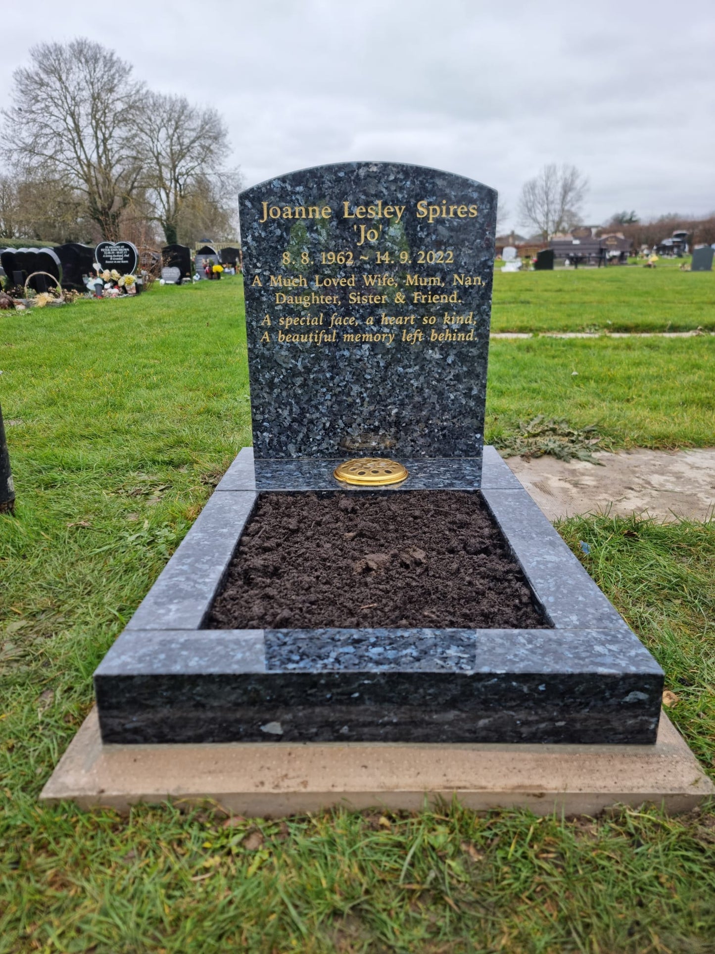 Pitched edge headstone and matching kerbs