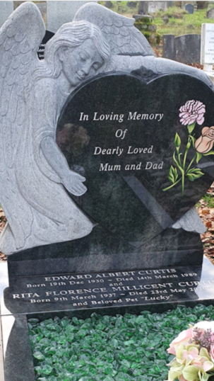 Carved Angel Leaning Over Heart Shaped Memorial