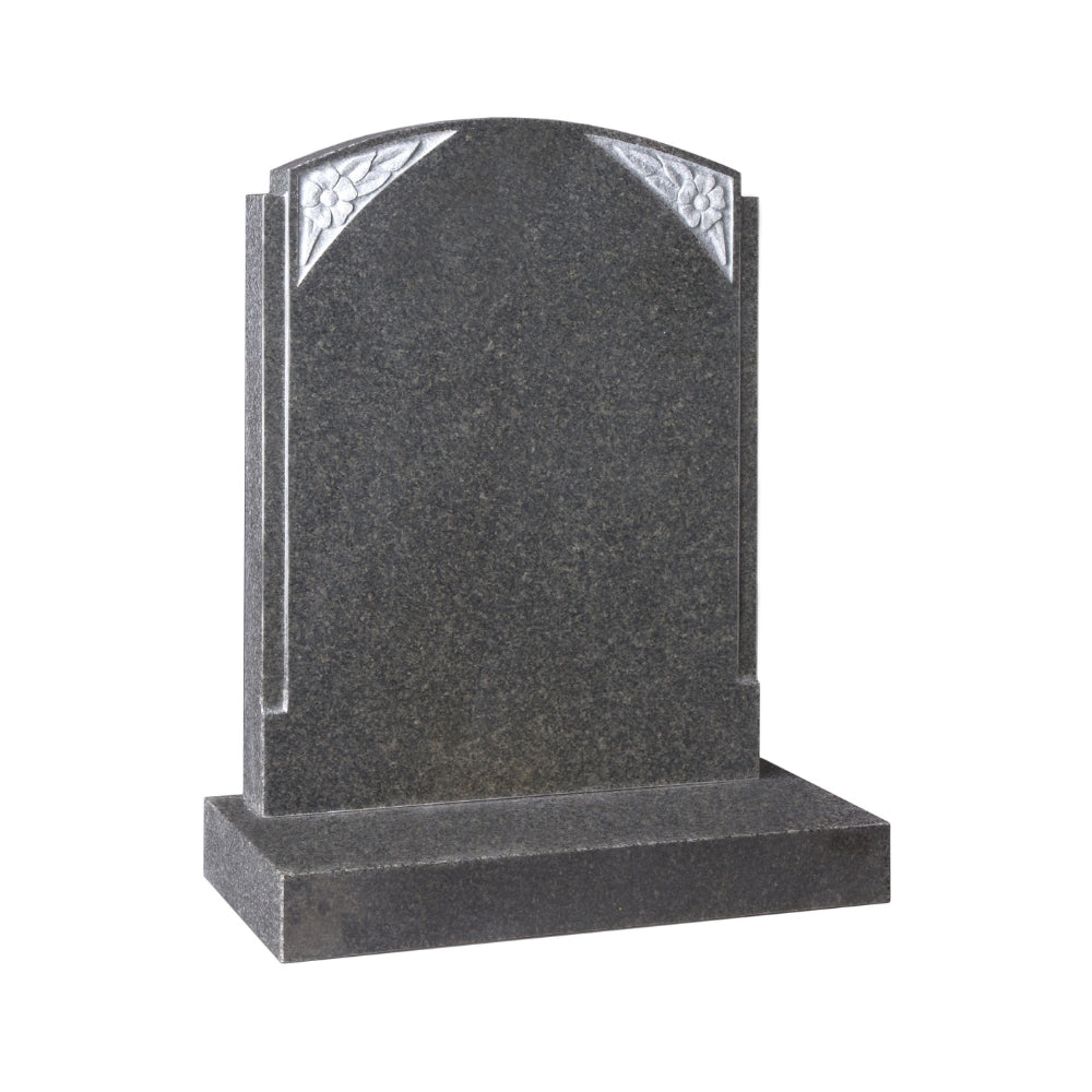 Ogee shaped memorial with rebated edges and carved flowers to corners