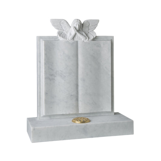 Carved angel resting over a book memorial with a square base