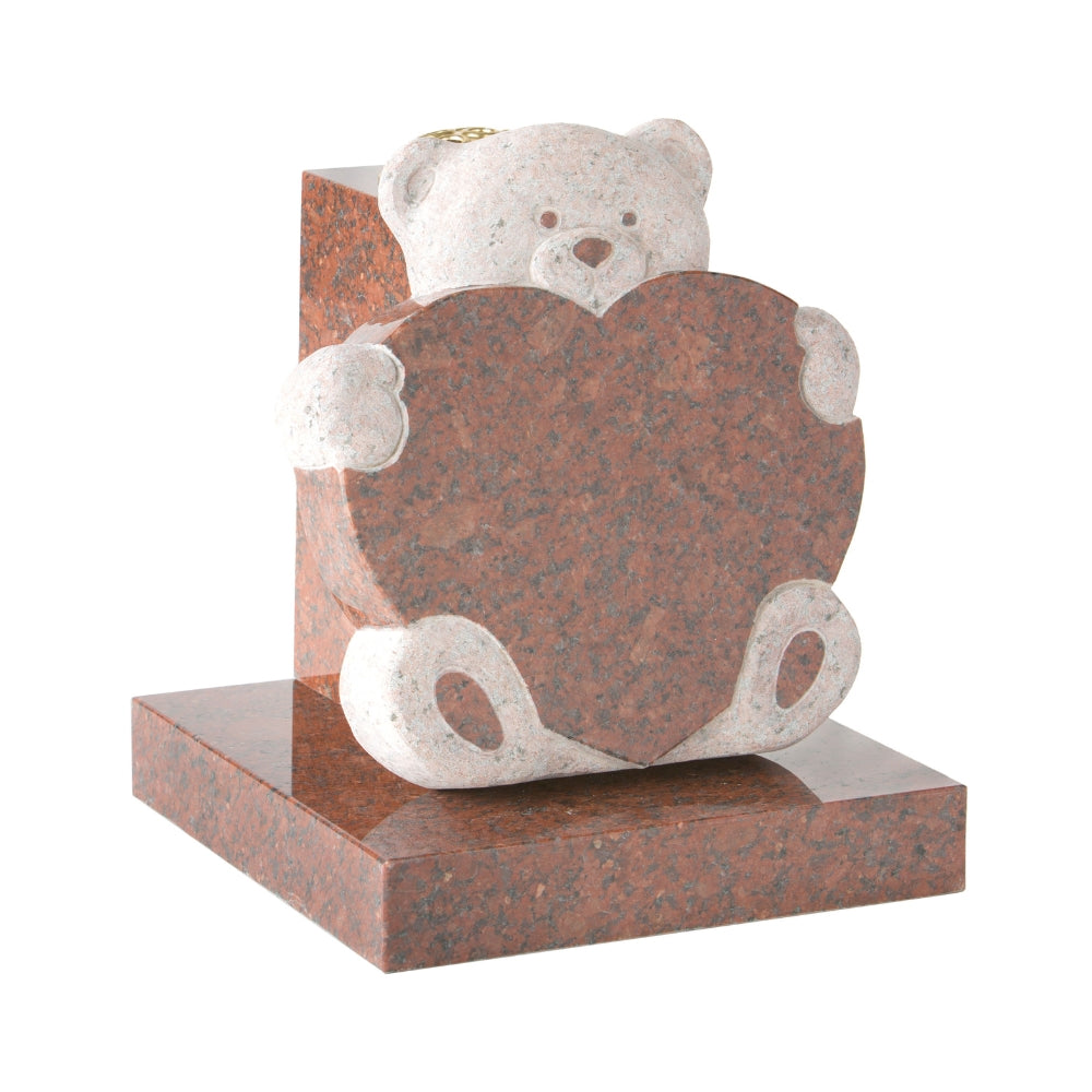 Carved teddy bear holding heart memorial with vase to rear