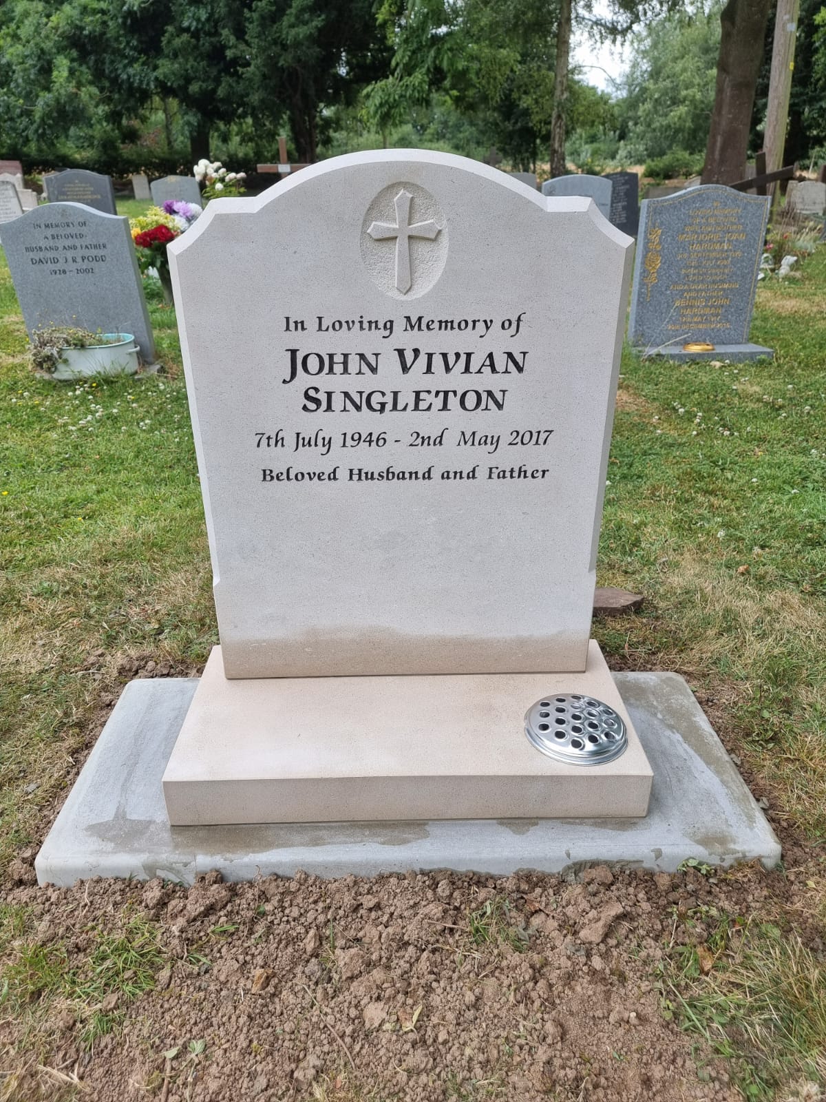 Oval top with ogee shoulders memorial with optional baby and moon design