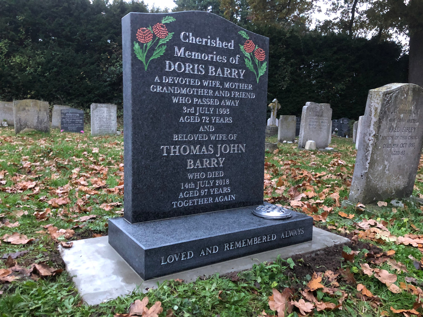 Ogee top memorial with carved roses to shoulders