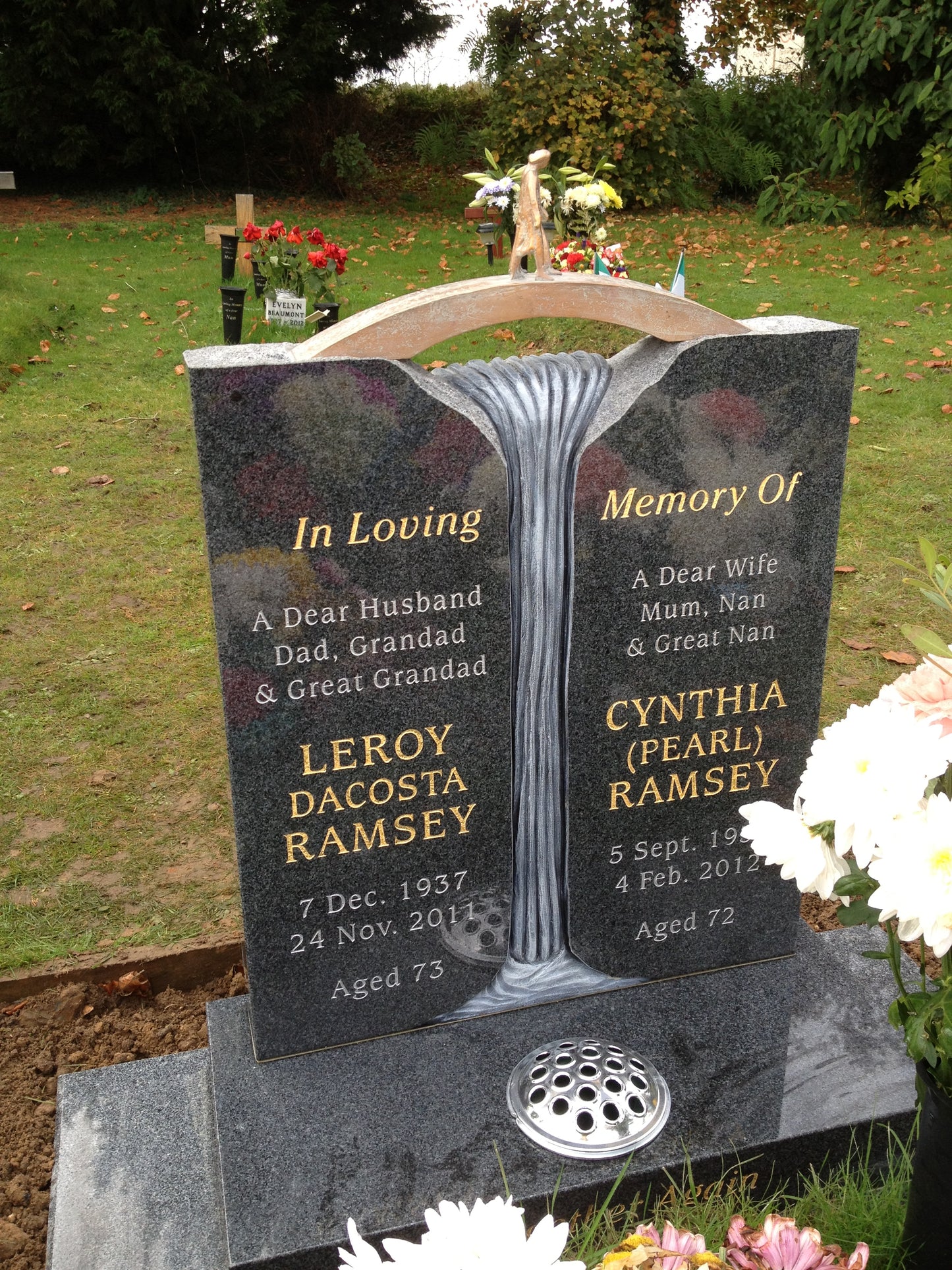 Rustic edge crossing memorial with bridge, figures & carved waterfall ...