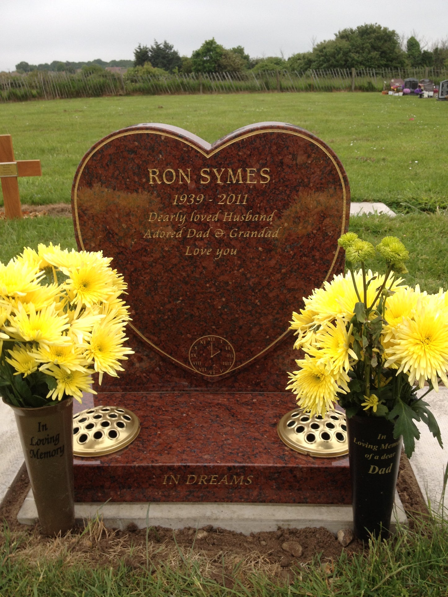 Heart shaped memorial with ogee front base and carved wild roses