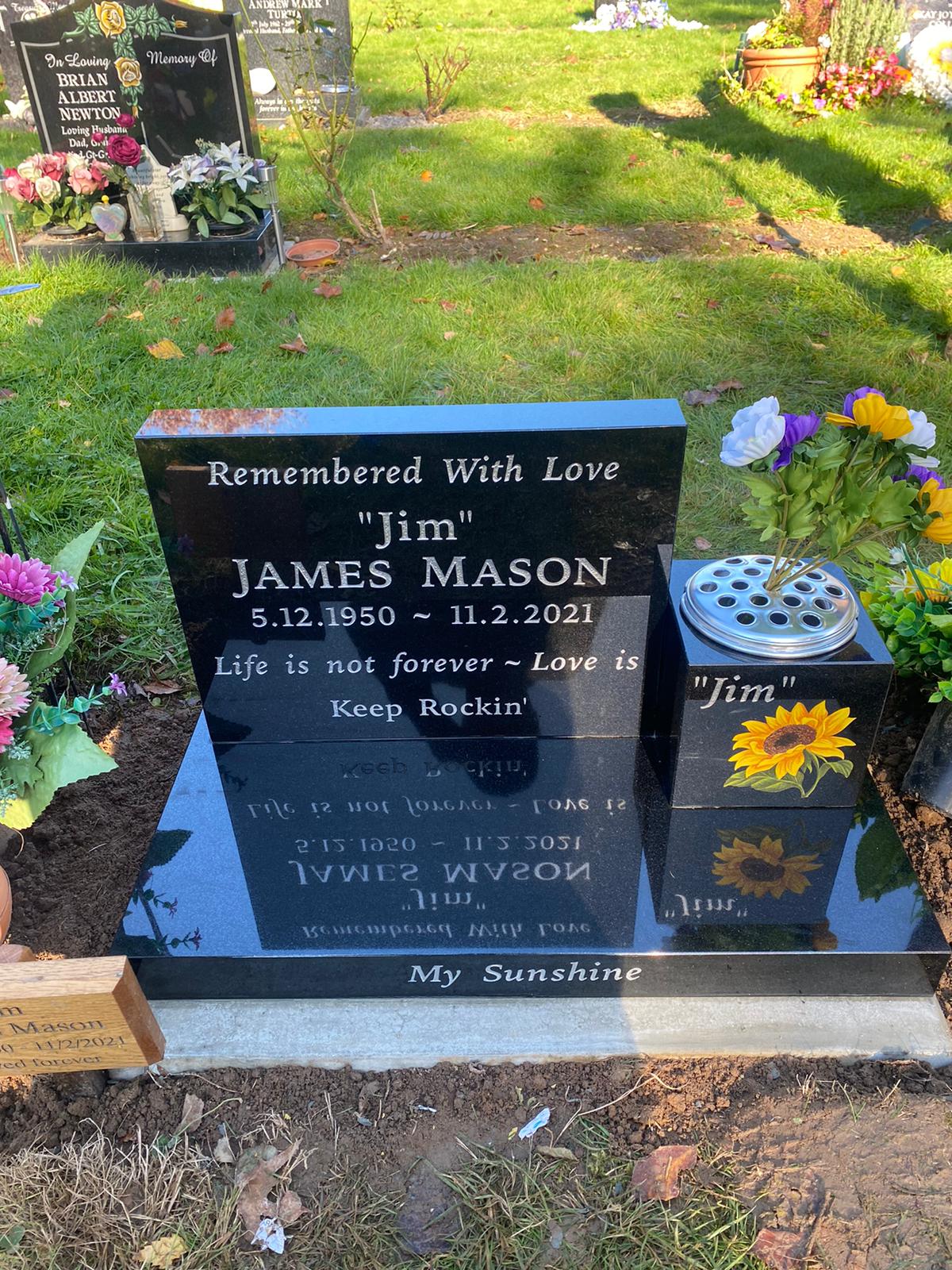 Tablet style headstone with free standing square vase.