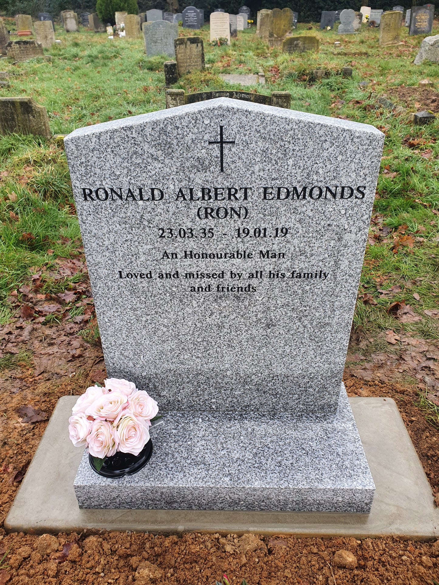 Peon top memorial with sandblasted rose and cross panel