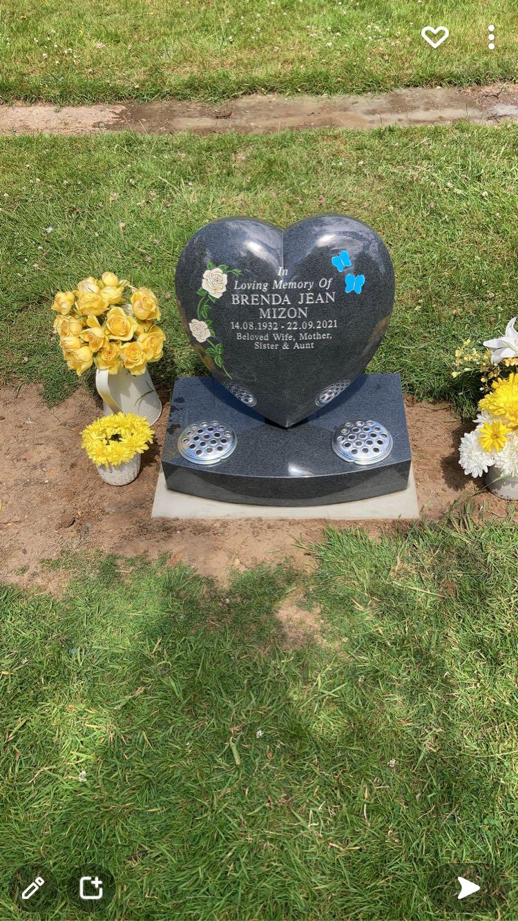 Heart shaped memorial with ogee front base and carved wild roses