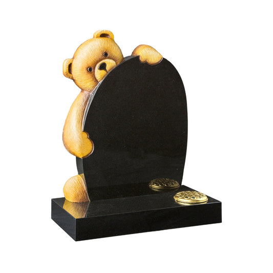 Carved teddy bear on a round top memorial with square base